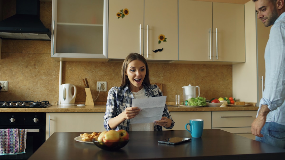 A family reviewing home care options and paperwork at a kitchen table