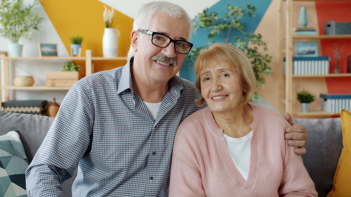 An older couple at home considering their care and living options together
